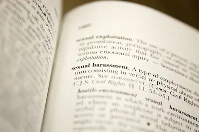 Book showing legal definition of sexual harassment