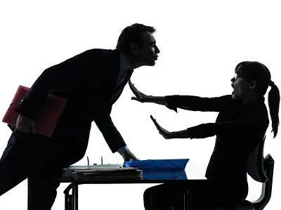 Two workers in silhouette sexual harassment