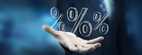 closeup of an open human hand with a graphic of percentage signs resting on the palm, against a blue background