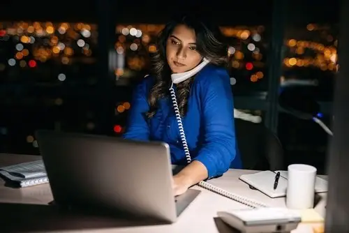 White-collar employee working late in office who is not entiteld to overtime pay