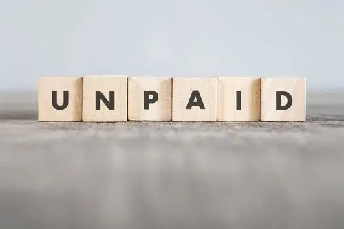 block of letters spelling "unpaid" - unpaid wage claims can be brought by aggrieved workers in California
